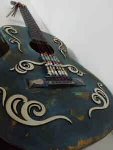 Laser Cut Detailing on Upcycled Guitar
